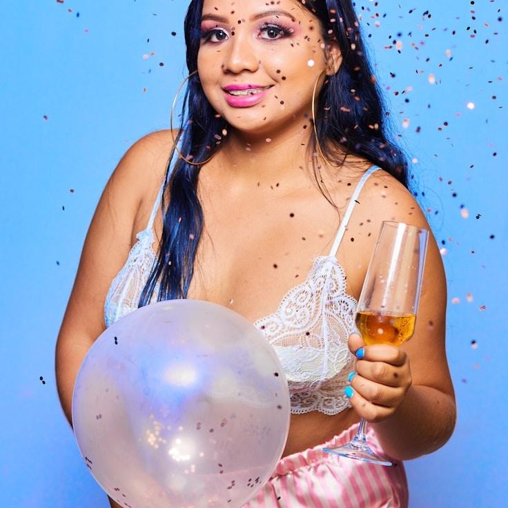 Kaveri Mehta, Lead Design Curator at ClearThreadLink, reviewing corporate floral arrangements